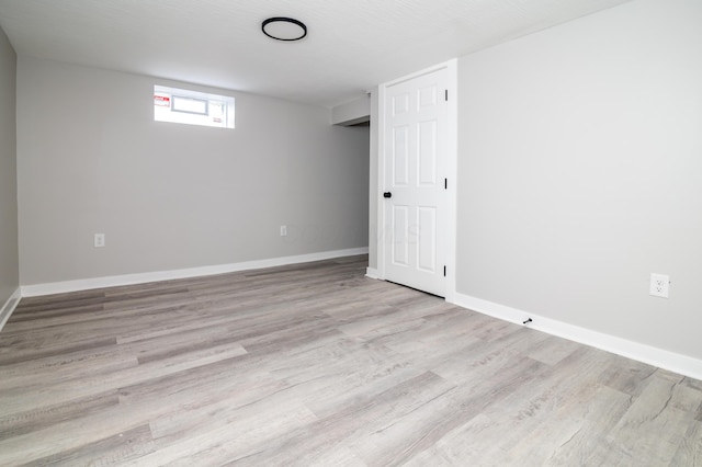 basement with light wood-type flooring