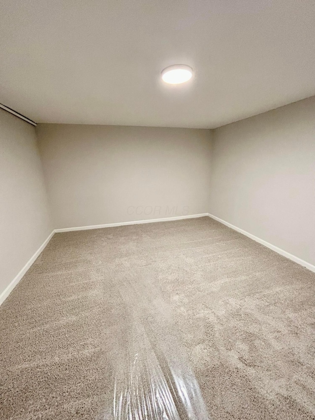 empty room featuring carpet flooring