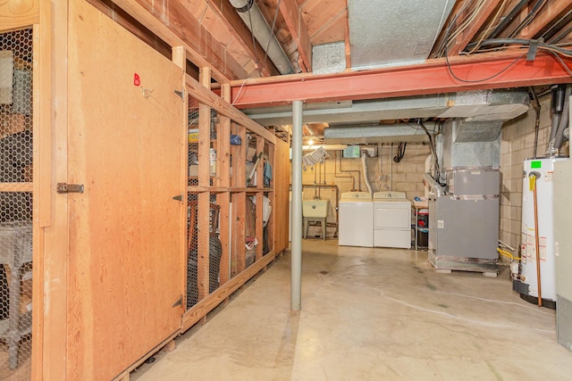 unfinished basement with heating unit, independent washer and dryer, a sink, and gas water heater