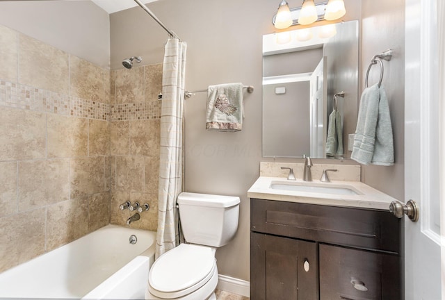 full bathroom with vanity, shower / bath combination with curtain, and toilet