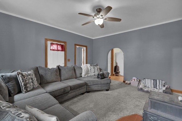 living room featuring ornamental molding and ceiling fan