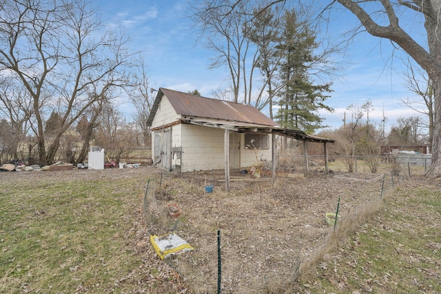 view of home's exterior with a storage shed