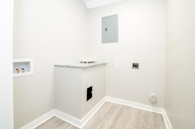 laundry room with hookup for a washing machine, electric panel, hookup for an electric dryer, and light wood-type flooring