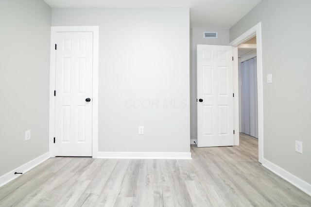 unfurnished bedroom with light hardwood / wood-style flooring