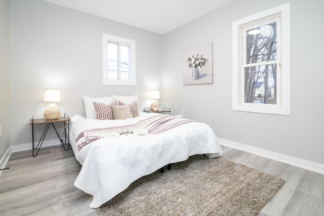 bedroom with light hardwood / wood-style floors