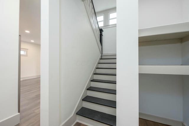 staircase featuring hardwood / wood-style floors