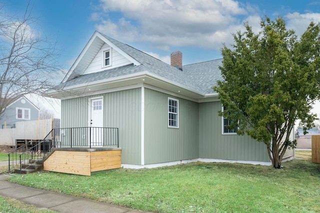 view of home's exterior with a lawn