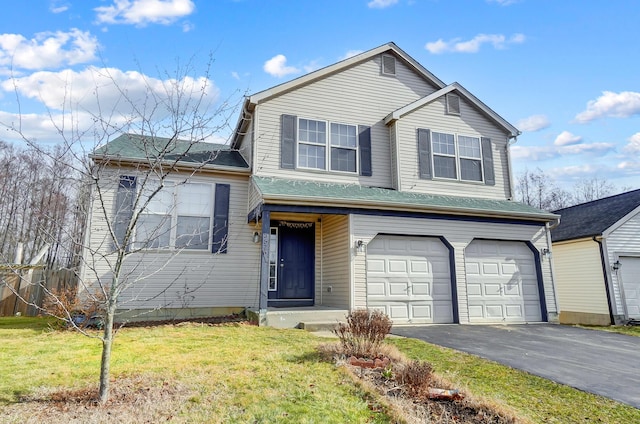 front facade with a garage and a front yard