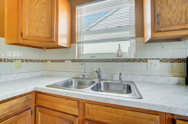 kitchen with sink and decorative backsplash