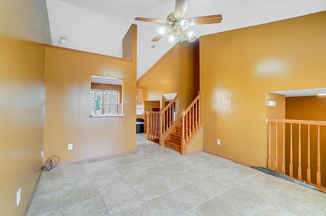 unfurnished room featuring high vaulted ceiling and ceiling fan