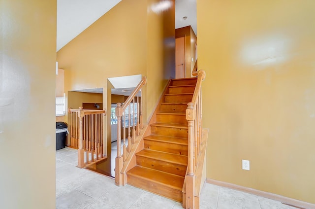 stairway with tile patterned flooring