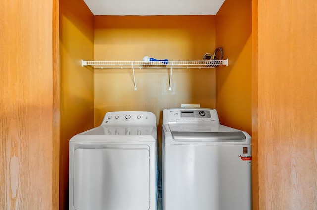 clothes washing area featuring washing machine and clothes dryer