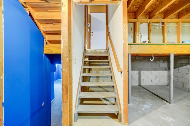 stairway with concrete floors