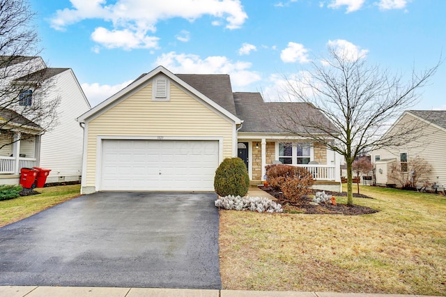 view of front of property with a garage and a front yard