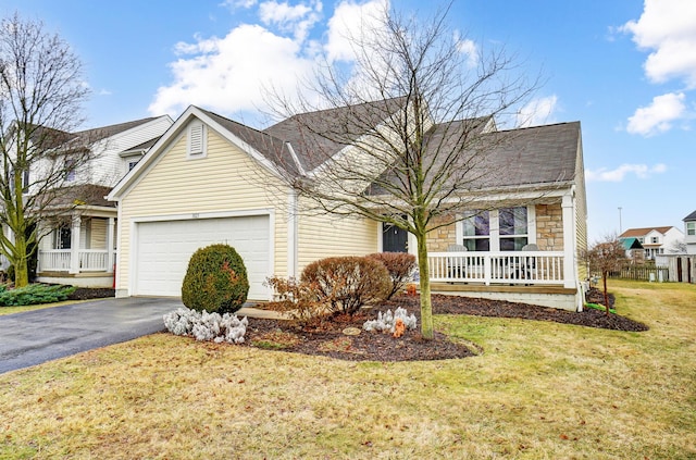 view of front facade featuring a garage and a front yard