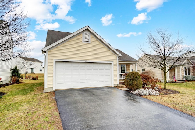 single story home with a garage and a front lawn