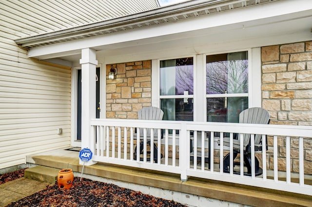 doorway to property featuring a porch