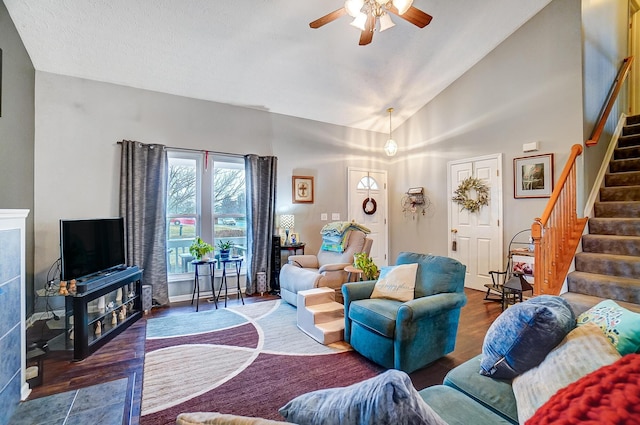 living room featuring ceiling fan, wood-type flooring, and high vaulted ceiling