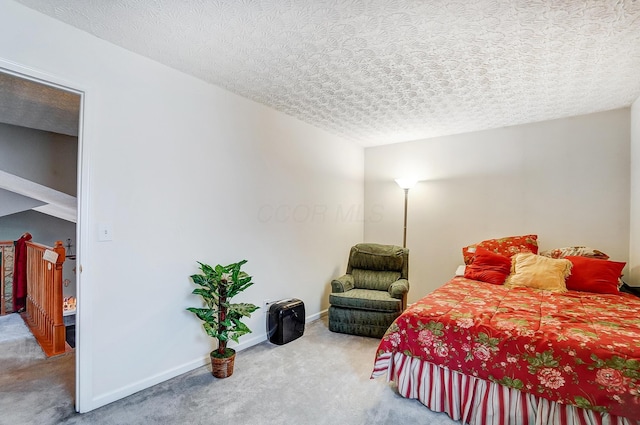 carpeted bedroom with a textured ceiling