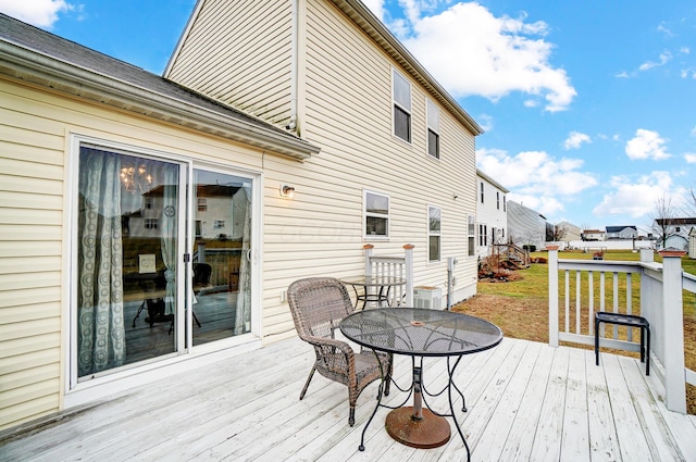 wooden terrace with a yard