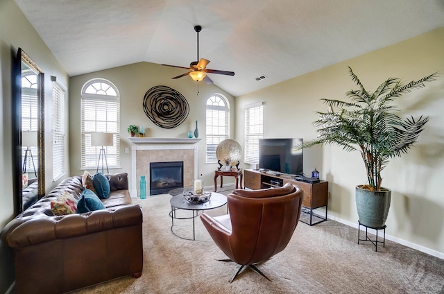 living room with lofted ceiling, plenty of natural light, and carpet flooring