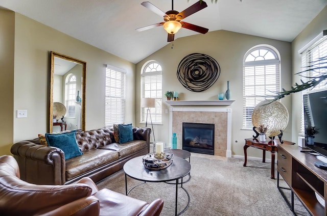 living room with a fireplace, plenty of natural light, carpet flooring, and vaulted ceiling