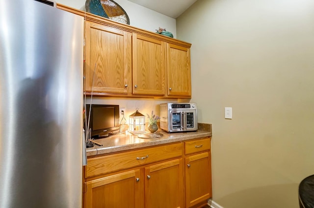 kitchen featuring stainless steel fridge