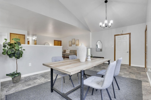 dining room featuring an inviting chandelier and lofted ceiling