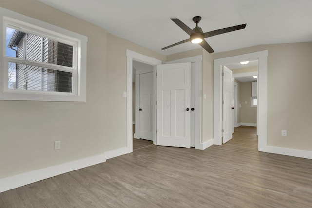 spare room with light hardwood / wood-style flooring and ceiling fan