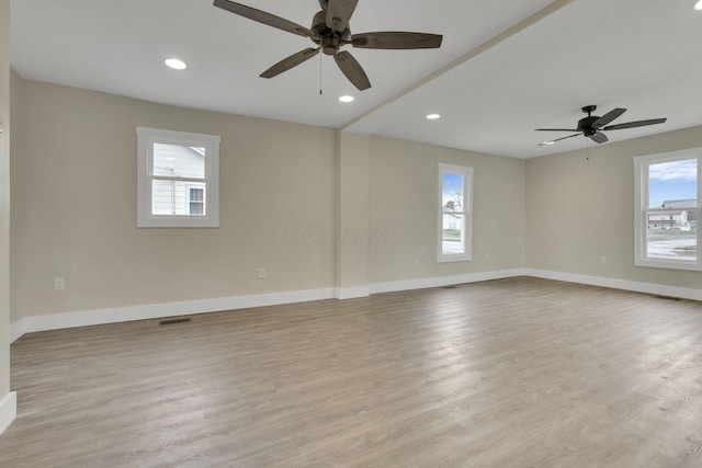 spare room with ceiling fan and light hardwood / wood-style floors