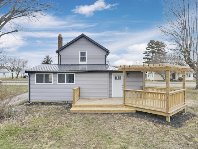 back of property with a wooden deck