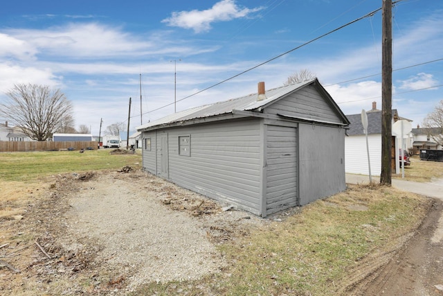 view of outbuilding with a lawn