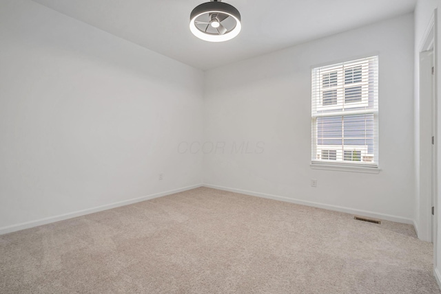 carpeted empty room with plenty of natural light