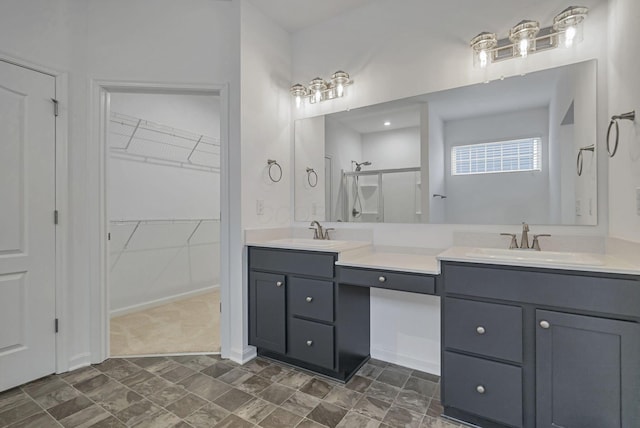 bathroom featuring vanity and a shower with shower door