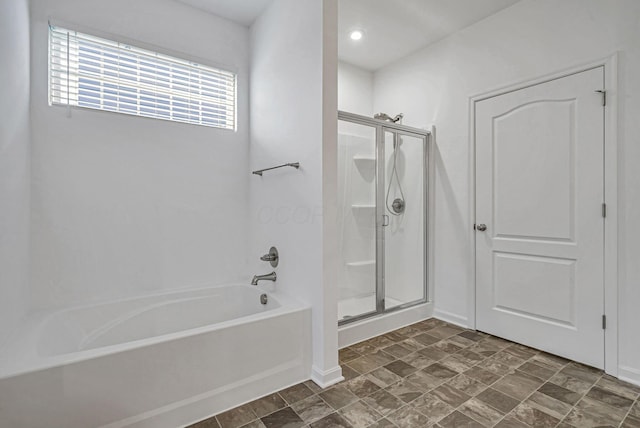 bathroom with shower with separate bathtub