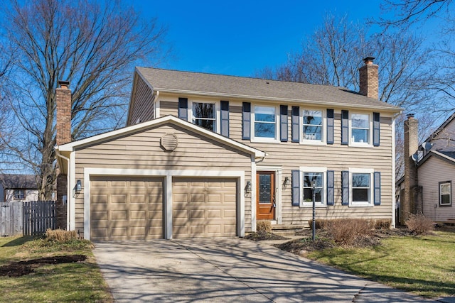 view of front of home with driveway, a chimney, an attached garage, and fence