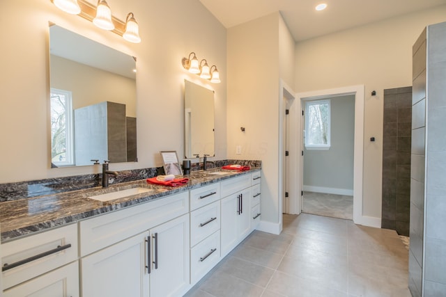 bathroom featuring tile patterned floors, vanity, and a wealth of natural light