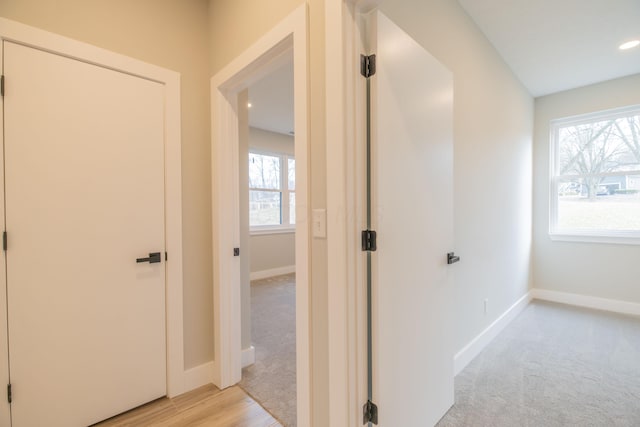 hallway with light carpet