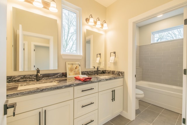 bathroom featuring vanity, tile patterned floors, and toilet