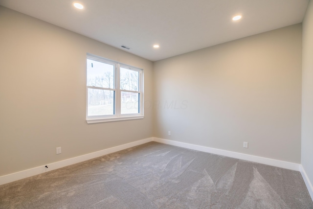 unfurnished room with carpet floors