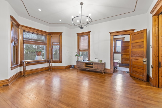 interior space featuring hardwood / wood-style floors and a chandelier