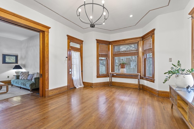 foyer featuring hardwood / wood-style flooring and a chandelier