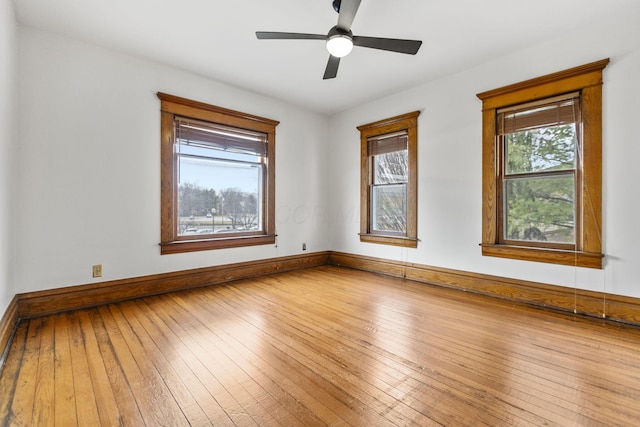 unfurnished room with hardwood / wood-style flooring and ceiling fan