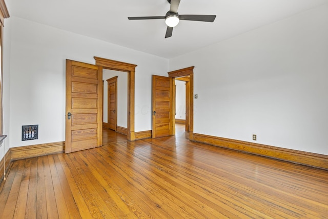 spare room featuring ceiling fan and light wood-type flooring