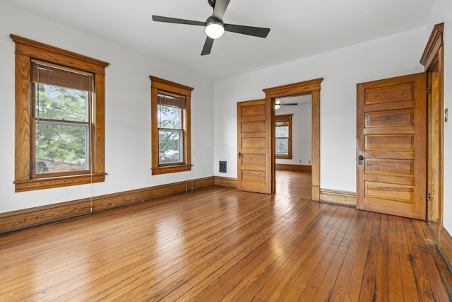 interior space featuring multiple windows and wood-type flooring