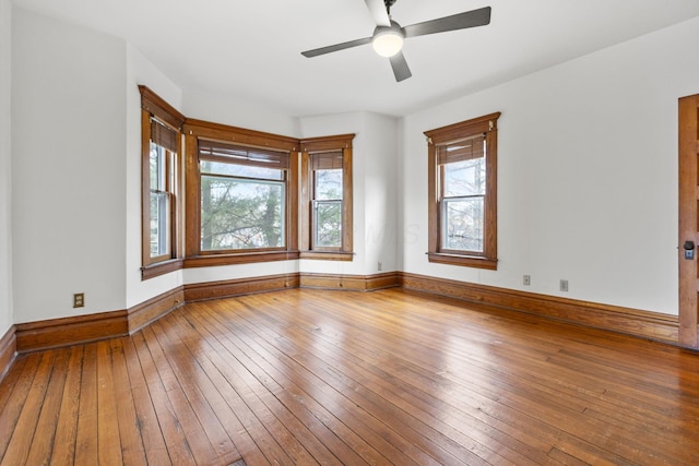 unfurnished room featuring hardwood / wood-style flooring and ceiling fan