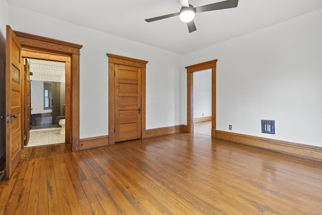 unfurnished room featuring ceiling fan and wood-type flooring