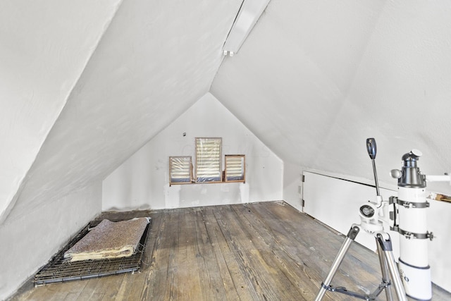 bonus room featuring hardwood / wood-style flooring and lofted ceiling