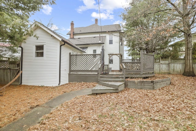 back of property featuring a deck