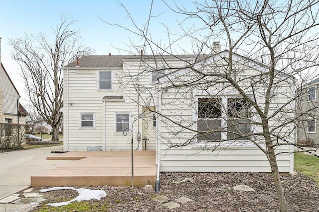 back of property featuring a deck